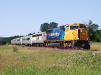 Desperate times call for desperate measures. If I recall, Ontario Northland had experienced some washout-related derailments in the Spring that put a few of the GP38-2s and/or GP40-2s out of service. Locomotive availability was so strained that Ontario Northland was forced to use a SD75I on a round trip on the Northlander to Toronto.  Northbound ONT 121 (CN 697 on CN rails), is shown here north of Toronto on the CN Bala Sub.  Proof that the Alaska Railroad isn't the only railroad to employ a SD70 variant in passenger service; soon to be joined by the Metra commuter agency in Chicago, IL.    