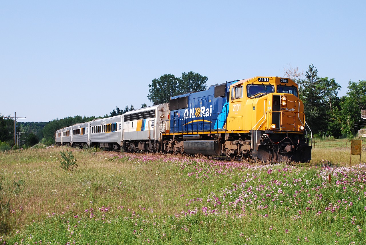 Desperate times call for desperate measures. If I recall, Ontario Northland had experienced some washout-related derailments in the Spring that put a few of the GP38-2s and/or GP40-2s out of service. Locomotive availability was so strained that Ontario Northland was forced to use a SD75I on a round trip on the Northlander to Toronto.  Northbound ONT 121 (CN 697 on CN rails), is shown here north of Toronto on the CN Bala Sub.  Proof that the Alaska Railroad isn't the only railroad to employ a SD70 variant in passenger service; soon to be joined by the Metra commuter agency in Chicago, IL.