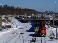 CN 305 is stopped at Turcot Ouest after changing crews and will depart as soon as VIA 35 passes. CN 305 unusually has intermodal traffic up front.