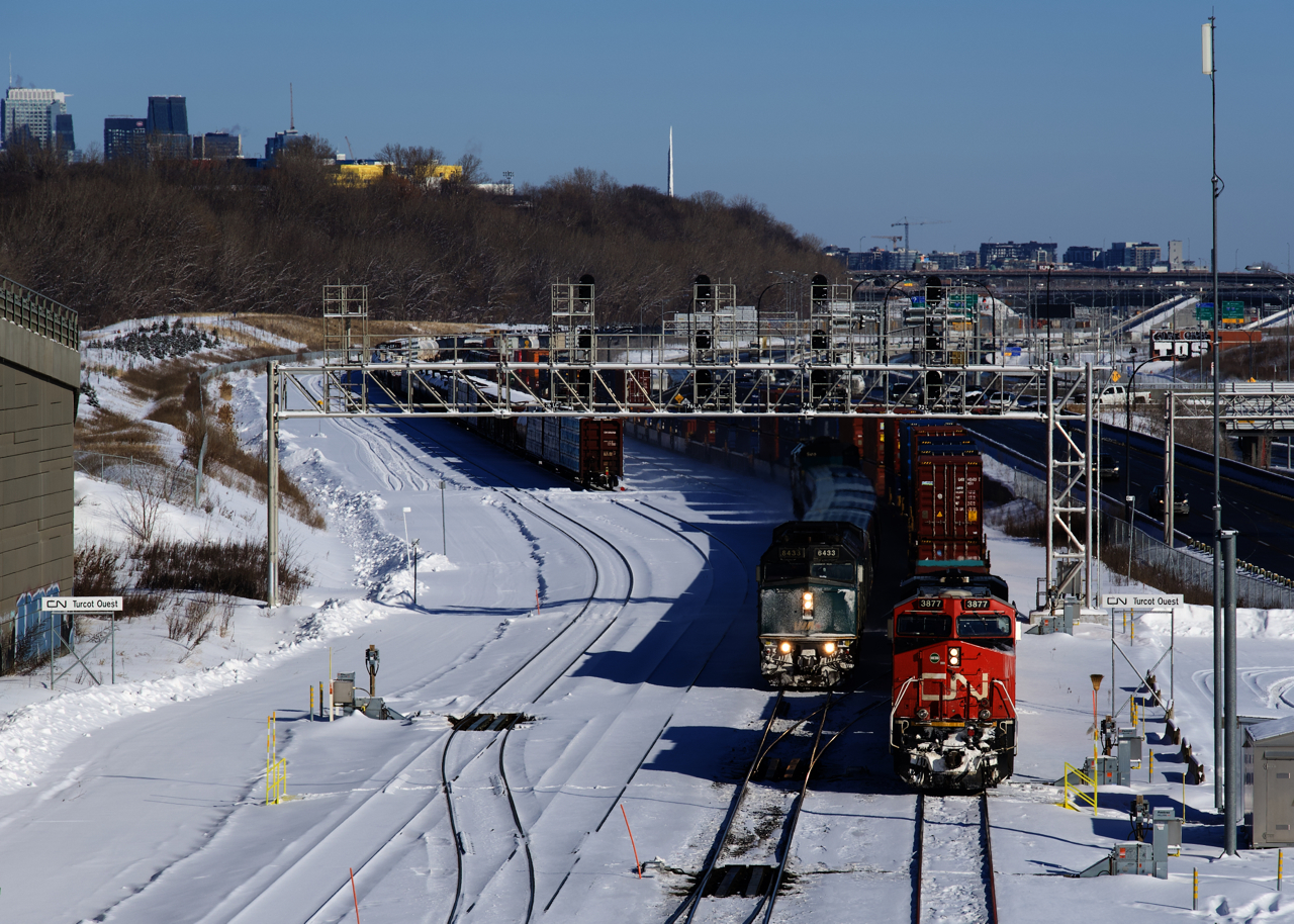 CN 305 is stopped at Turcot Ouest after changing crews and will depart as soon as VIA 35 passes. CN 305 unusually has intermodal traffic up front.