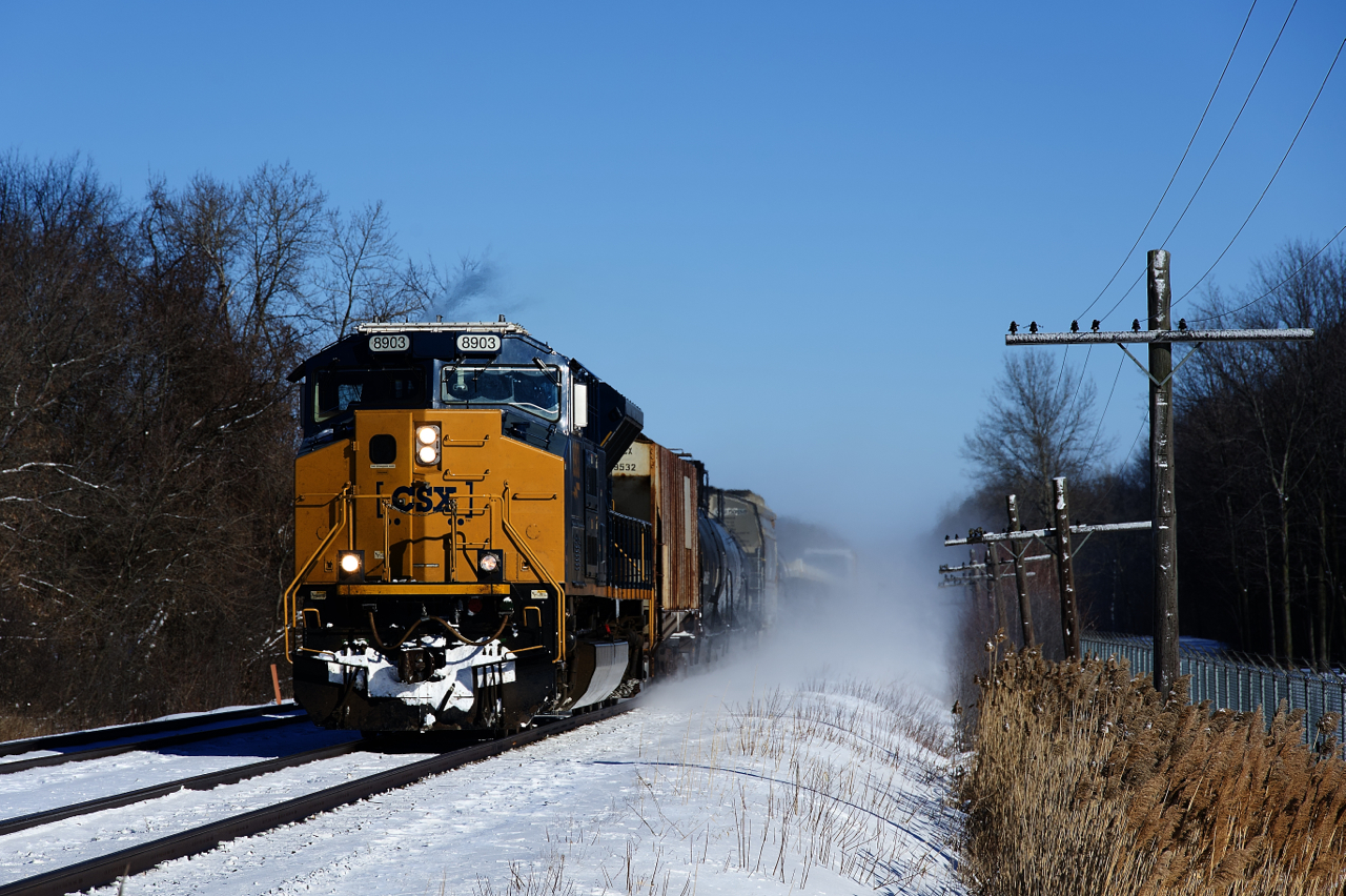 A single SD70ACe-T4 is powering CN 327 as it approaches Coteau where it will set off cars.