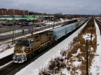 A CN unit in Citirail paint (CN 3915) is bringing up the rear of CP 112, with another one mid-train (CN 3973). Ahead of the rear DP are 49 grain cars destined for CN, including three brand new UCIR cars that have build dates of January 2022.