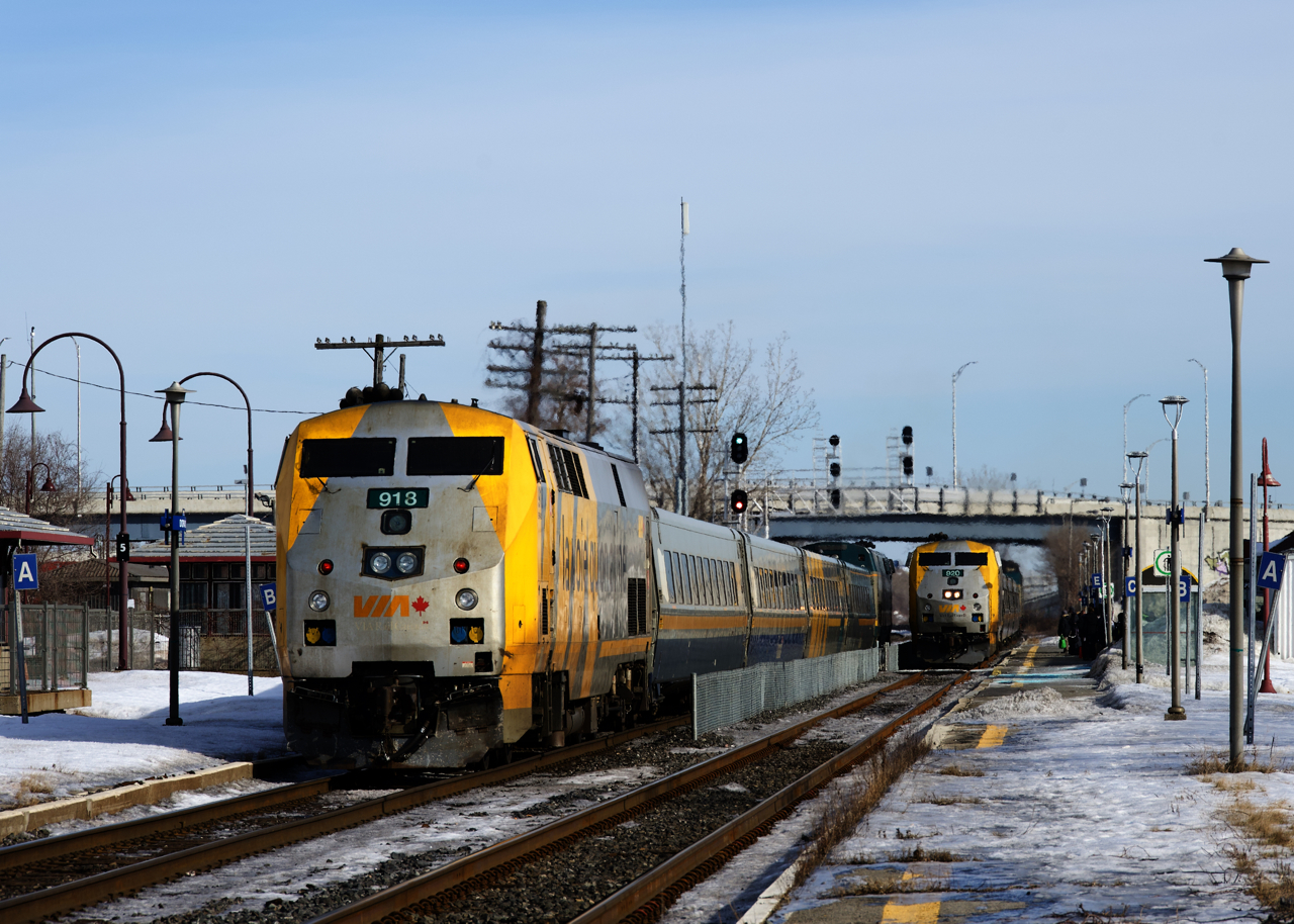 VIA 62 on the left and VIA 67 at right are arriving at Dorval Station simultaneously. Generally VIA trains in either direction will only be on the south track, so it's rare to see a meet like this.