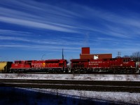 Grain train CP 330 is passing through Dorval with CP 8926 and shiny CP 7004 up front.