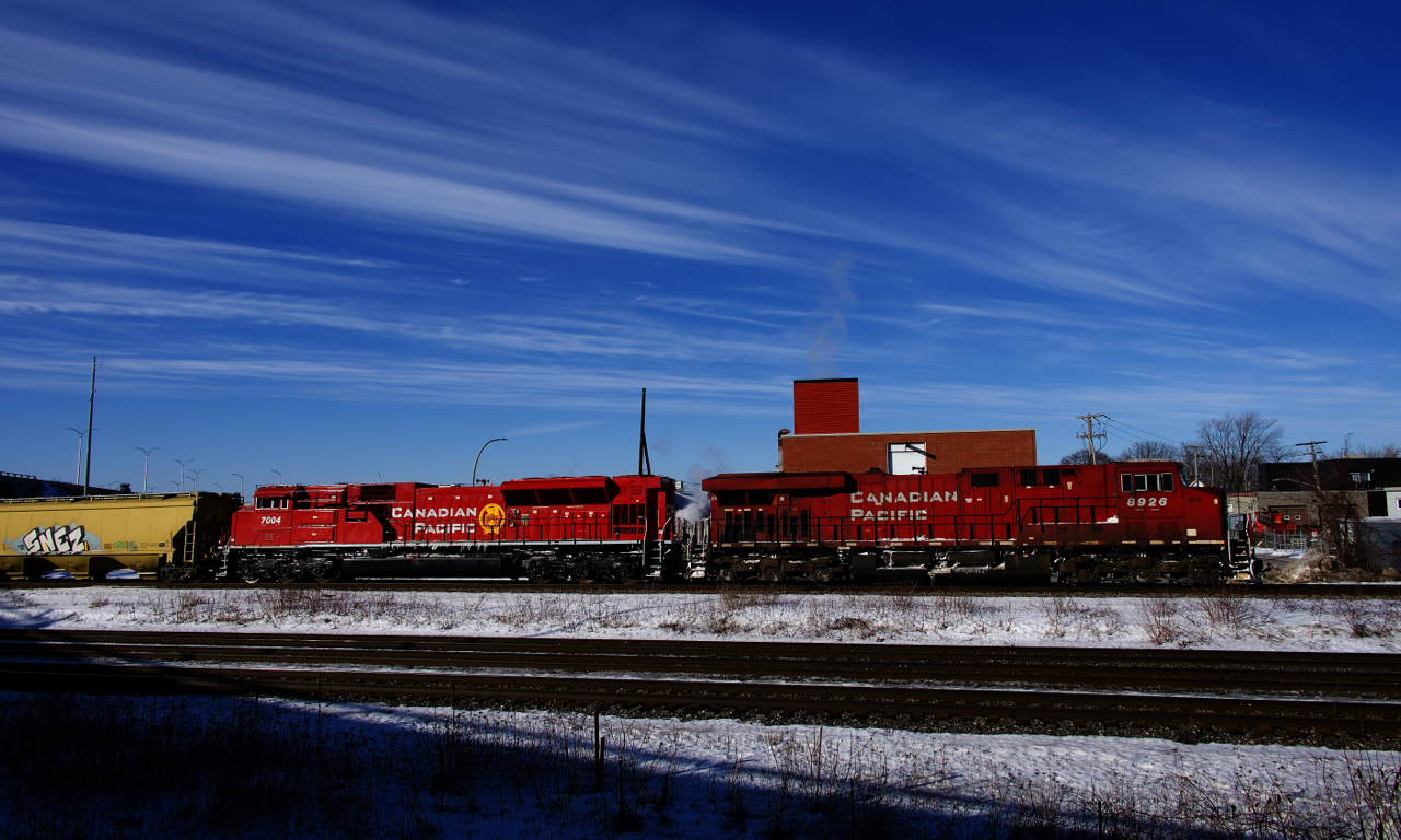 Grain train CP 330 is passing through Dorval with CP 8926 and shiny CP 7004 up front.