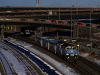 A pair of F59PH's lead EXO 1207 for Mascouche past the Turcot Interchange.
