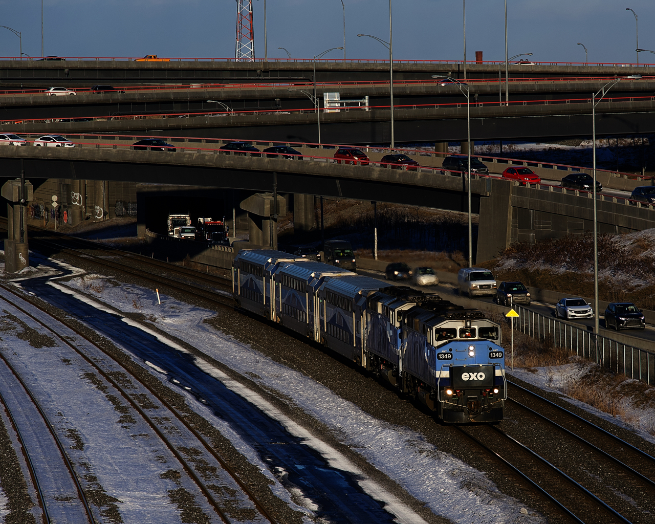 A pair of F59PH's lead EXO 1207 for Mascouche past the Turcot Interchange.