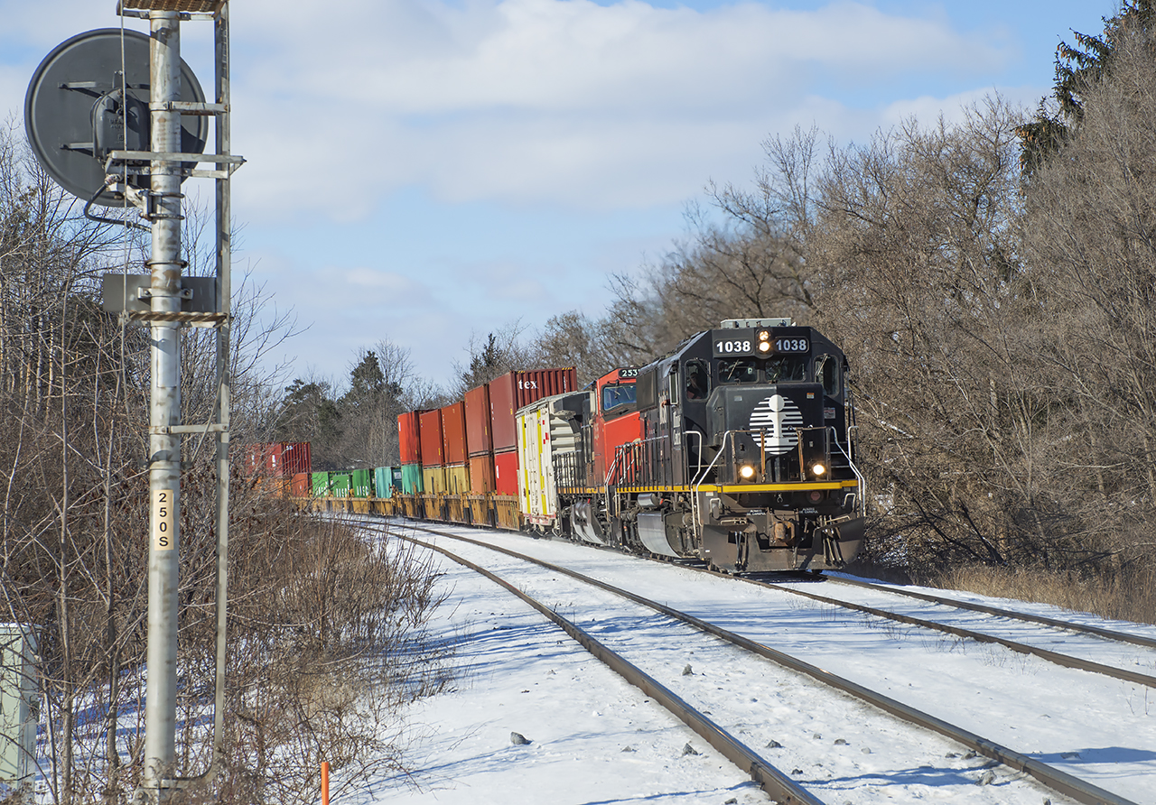 CN 148 heads eastbound at Hardy with SD70 IC 1038 leading the way.