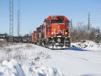 CN L542 rounds the south leg of the wye in Guelph's north industrial park with 19 cars on the drawbar, including 17 from interchange with the GEXR.
