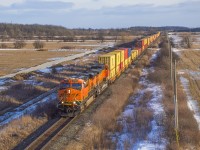 Bring up the rear of four consecutive eastbounds in about 45 minutes, Q162 rumbles through Ash with BNSF up front and shoving on the rear.