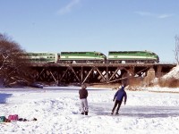 I’m not much for wandering around on frozen rivers but I didn’t want to lose the chance of framing some Canadian winter activities in front of a passing GO train. A full on hockey game would have definitely made the shot but unfortunately they cleared the ice before I arrived. I have always liked this unique bridge in Port Credit and it’s unfortunate that these days it is almost impossible to capture a freight train of any kind in daylight here. It’s hard to believe there were once numerous rail servers industries in Port Credit, especially Texaco and St. Lawrence starch, now all history as the town is now more focused on tourism like so many other lakeside towns in the region.