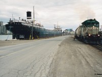 Goderich-Exeter Railway (GEXR) GP9 177, departs the large Sifto Salt mine in Goderich, Ontario with three hoppers and heads up the steep grade towards the yard on April 28, 1995. The former Cartier Railway unit would operate on GEXR until 2002, after a damaged main generator sidelined it for good.

