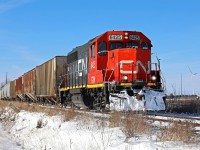 Trundling southward on CN's Sarnia Spur, GTW 6425 and 8 car Blenheim-bound train L514 passes mile post 11 on former owner Chesapeake and Ohio's Subdivision No. 2 at Fargo Ontario.