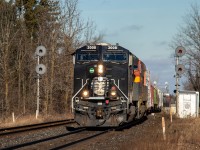 As OBRY made one final trip down the CP Owen Sound Sub, CN decided to send a cool CN M397 to distract us from the disappointing day. CN 3008 (Illinois Central "deathstar" paint) and KCSM 4871 haul a good sized train past the searchlights guarding the Stewarttown bridge.

CN 3008 is painted in a replica IC scheme for the 25th anniversary of CN being privately owned (being an IPO). It is one of 6 locomotives in a collection, portraying the companies that CN has absorbed since 1995.

One last note is of the creek. This is the only single track section of the Halton sub between Mile 5 (Humber) and mile 28 (Speyside). I wonder if CN has any plans to double track the bridge over the creek as Stewarttown is known to create bottlenecks. If they do, I'd have to think those gorgeous looking searchlights get replaced. 