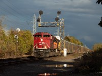 CP 7033 as well as a BNSF gevo are in the lead of 147-02 as it passes through Bartlett on a beautiful fall evening.
