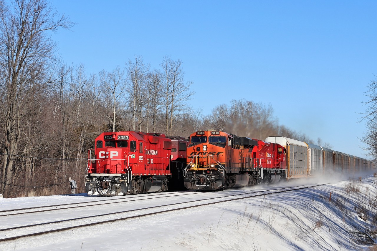 I had actually went to Guelph Junction to get a shot of CP 234 and CP 147 and found the power of T69 sitting idling away in the siding. After CP 234 departed, CP 147 led by BNSF 6558 and CP 7042 flew by at full track speed which made for a very nice side by side with the CP 3053. T69 would sit there all weekend and eventually the second unit froze up and  CP 3053 would be very low on fuel but they still managed to make it westward on Monday.