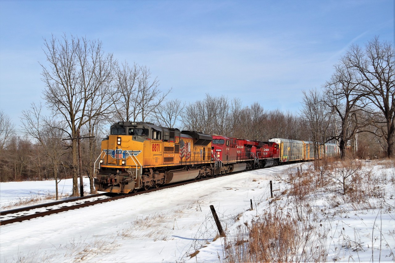 This Union Pacific 8871 engine had quite the time the last few days. It ran light power eastward yesterday to rescue CP 255 at Guelph Junction and led back west later that day to quite the crowd of railfans. It then ran back east and south down the Hamilton sub for a pick up over night. Today was its return trip as 2T69 where it led the original power for CP 254/255 in CP 8704 and CP 8077 back west with 6800 feet of auto racks.