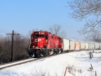 It's later in the morning and T69 is sent early to pick up a load at Guelph Junction. The leader was the common CP 3053 east but the clearance back west drew my attention as CP 4447 so off I went. Here it about to cross Victoria Road in Puslinch with 168 axels and 2520 feet of manifest cleared right to London so it could begin its usual pickups that day. The fresh slow is still blowing off the hopper cars at builds to track speed.