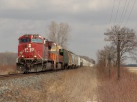 A Rare CP 141 blasts through one of the many open fields in Chatham Kent with a creamsicle trailing. In the background, you can see one of the oldest signals to remain of the CP Windsor Sub. The crew was friendly and gave us a small horn salute. 