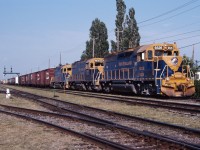 Today, the CN train interchanging with the New England Central at St. Albans, Vermont runs with CN power (or whatever is around Taschereau Yard). But for a few years after the Central Vermont was sold, CN provided the crews and NECR provided the power for the Montreal-St. Albans turn. Here we see NECR 6526 (former CSX/B&O GP40), 9530 and 9539 (former IC/GM&O GP38s) leading the train through St-Lambert on a warm August evening. Hard to believe that almost 25 years have passed since this shot was taken...