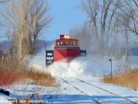 As I posted in an <a href=http://www.railpictures.ca/?attachment_id=47935 target=_blank>earlier photo</a> the action was minimal on OSR's plow run on February 9 but.. there was some. Just north of the hamlet of Ostrander the line passes through a farmers field that is notorious for drifting. And this was where I found some action - A little bit of drifting is broken apart by OSR's 401005 but not too much so you can see the rest of the plow :) On a really good plow run you'll see <a href=http://www.railpictures.ca/?attachment_id=21855 target=_blank> nothing but white stuff </a> flying and a headlight. Sometimes you just want a little action so you can see the rest of the train as seen <a href=http://www.railpictures.ca/?attachment_id=12926 target=_blank> here in 2014</a>. That last plow chase on Jan 9 2014 was fun, after that shot the roads were closed due to ice.... didn't catch up... 