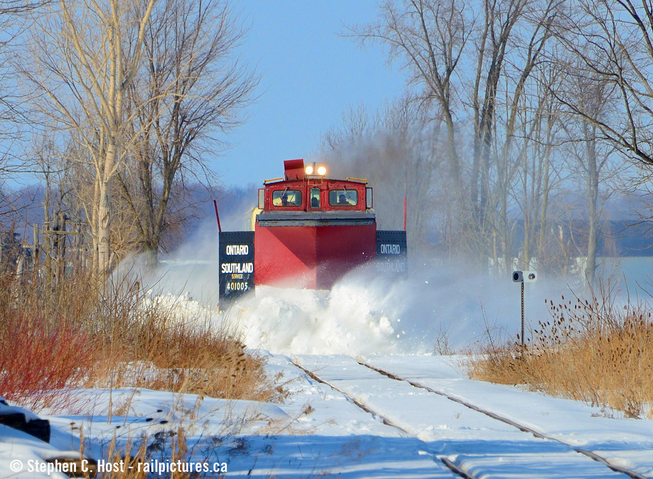 As I posted in an earlier photo the action was minimal on OSR's plow run on February 9 but.. there was some. Just north of the hamlet of Ostrander the line passes through a farmers field that is notorious for drifting. And this was where I found some action - A little bit of drifting is broken apart by OSR's 401005 but not too much so you can see the rest of the plow :) On a really good plow run you'll see nothing but white stuff flying and a headlight. Sometimes you just want a little action so you can see the rest of the train as seen  here in 2014. That last plow chase on Jan 9 2014 was fun, after that shot the roads were closed due to ice.... didn't catch up...