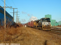 One for James Knott and the Hamilton goons. Some young fans today might think - foreign power! This was not foreign. It was Norfolk Southern crew on a Norfolk Southern train in Canada and they ran two trains per day to/from St. Thomas and Buffalo along with the <a href= http://www.railpictures.ca/?attachment_id=30303 target=_blank>NS 445/369 (NF/Fort Erie transfer which still runs today)</a>. I wish I paid closer attention to the NS trains back then but context validates why we didn't: Things were just too good elsewhere along with the fact despite the power overnighting in St. Thomas we didn't always know what was coming - information wasn't as free flowing as it is today. Besides this was just another mundane NS GE - this was the way it was on half the NS trains in Canada and GE's were as boring then as they remain today. The typical game plan was to get trackside for NS (by 0800 in Hamilton as they ran *early* out of St. Thomas) then go find CN or CP as it were afterwards - there was always something good coming just around the corner.<br><br>
Time is 0837 so you can see why we had to get somewhere early...