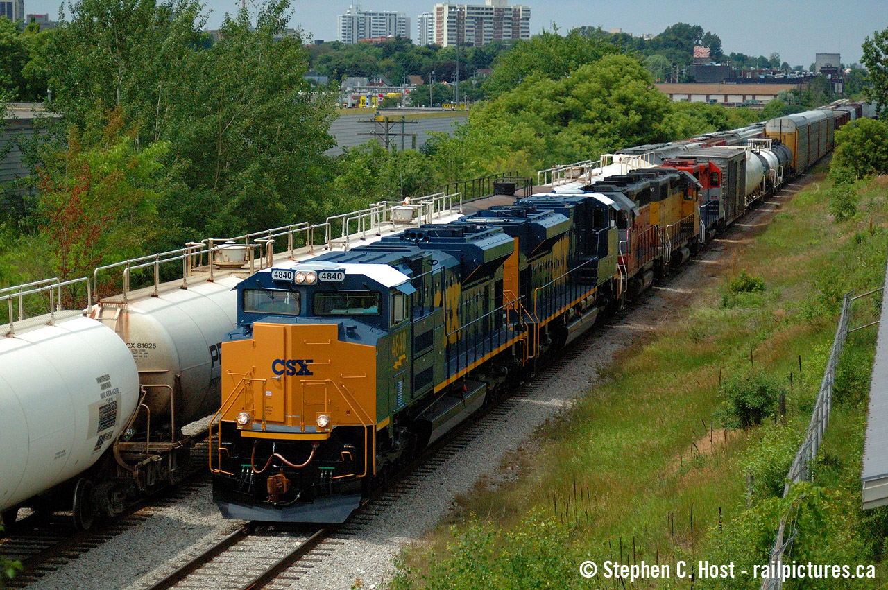 I've grown to like this angle, for two reasons: this shows Kitchener before the development explosion and of course, these CSX units which were being tested on GEXR 432/1 that summer are off the CSX roster - and what a summer it was. I do believe some of these are up north in Labrador and Quebec on the iron ore roads now as leasers. Either way, with the mainline blocked with cars this was the only angle available to me, and one of the few times I pulled anything half decent here. It's grown in even more and much harder to do.. after all it's been nearly 18 years..