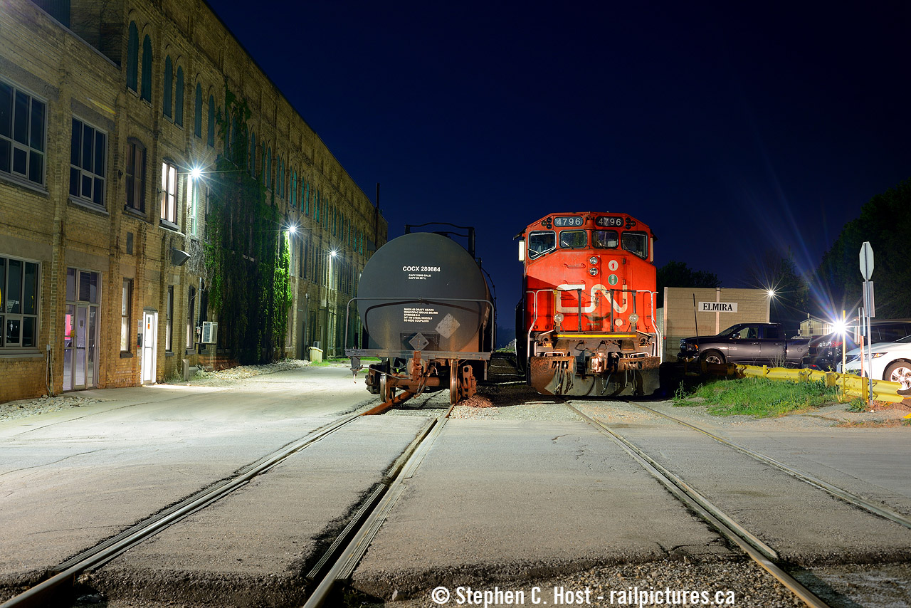 There's no mistaking this location - CN L566 is parked in Elmira at the Lanxess (formerly Chemtura/Uniroyal opened in 1942) chemical plant near the end of the line of the CNR Waterloo spur. I did a similar photo in the  GEXR days .