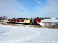 If there's one thing about the OSR and plowing, it's fish in a barrel. All you have to know is they're running and you can at least get *something*. Thanks to a well timed social media post, I heard they went from Woodstock to St. Thomas first thing in the morning with the Port Burwell sub to Tillsonburg to come later. Knowing a St. Thomas run takes hours, I knew I had a chance. I timed it just right so I could arrive as they were heading south, and lucky for me after a cloudy morning the sun came out at lunchtime for their relatively short (less than an hour) journey to Tillsonburg. Pictured for the first time a pair of repainted F units are on a plow as they head south passing snowmobile trails approaching the DeBruyen Farm. There was very little (snow) action to be had, but the F units and plow sure look purdy (heh heh heh) in the sun.