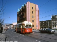 TTC PCC 4635 (an A11-class ex-Cleveland car) operates on the Kingston Road route short-turning at Church, heading westbound on Wellington Street just past Church Street (looping via Church-Wellington-York, then east on Queen and back to Kingston Rd). This area of downtown Toronto east of Yonge Street is known as the St. Lawrence Neighbourhood, home to the iconic Gooderham Flatiron building (behind 4635), and the St. Lawrence Market visible in the distance. Much of the old heritage buildings in this area have been retained, and the old Gooderham Flatiron has become a favourite for local urban photographers.
<br><br>
<i>Original photographer unknown, Dan Dell'Unto collection slide.</i>