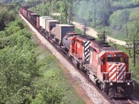 <br>
<br>
   CP Rail 5604 (SD40-2) and  5562 (SD40)  power CP Rail #88 on the approach to Carley.
<br>
<br>
    South of Medonte, near mile 88 Mactier Subdivision, June 2, 1979 Kodachrome by S.Danko
<br>
<br>
     <a href="http://www.railpictures.ca/?attachment_id= 19666 ">  more SD's at Medonte  </a>
<br>
<br>
   sdfourty
