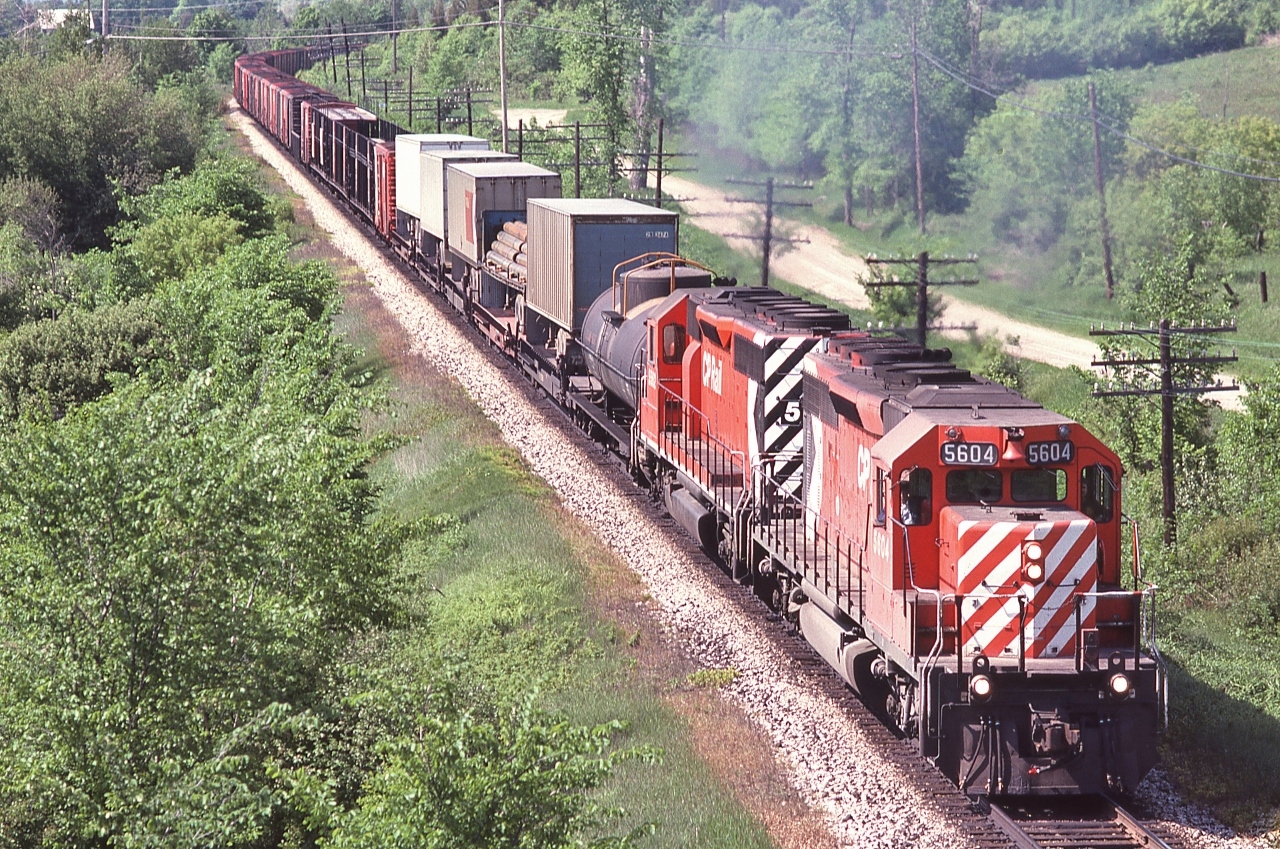 CP Rail 5604 (SD40-2) and  5562 (SD40)  power CP Rail #88 on the approach to Carley.


    South of Medonte, near mile 88 Mactier Subdivision, June 2, 1979 Kodachrome by S.Danko


       more SD's at Medonte  


   sdfourty