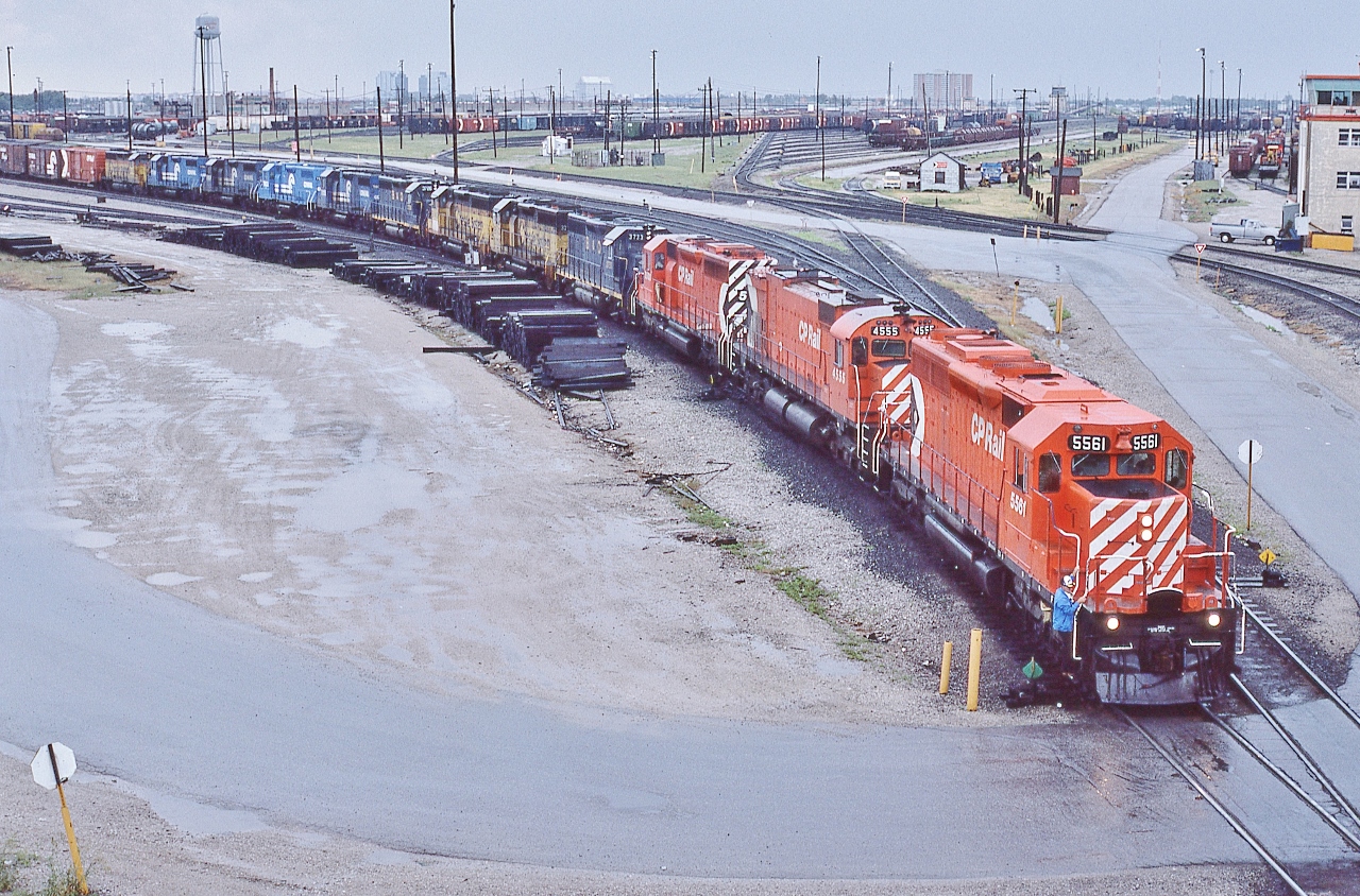 CP Rail days, could always count on 916 to have:


   1) mid-ish day departure from  Agincourt


   2) interesting lash ups


    and this is an EMD / GMD party ! ….well almost....


   awaiting the next downpour, prior to departure, CP Rail 916 at Agincourt, June 29, 1986 Kodachrome by S. Danko


        powered by CP Rail 5561 - 4555 - 5500 ;  a SD40-2 / M630 / SD40  combo, with lease units  


    in tow: B&O 3733, Chessie 3725, Chessie 3734, B&O 3726, CR 7805, CR 7803, CR 7804, CR 7789, Chessie 3732: 


    all leasers are EMD built: the B&O / Chessie are GP40; the Conrail are GP-38


    Note: GP40 B&O 3726  available in H.O. scale, Atlas Product Number: 10003227 


   And that ever present Canadian Pacific script water tower....


   sdfourty