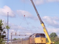 By this date upgrades along the Oakville subdivision were well under way to the point that the old switches and signal bridge at Aldershot West were in the process of being removed. This day cranes were busy disassembling the signal bridge as VIA train 70 with Spiderman 2 decorated F40 6401 rolls underneath. 