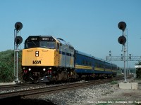 VIA F40PH 6441 leading an evening westbound through Aldershot West with four blue coaches in tow during August of 1992