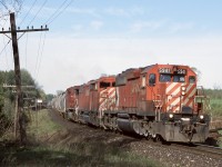There was a time when CP would run unit Potash trains to Putnum. While six axle power isn’t allowed on the St. Thomas subdivision these trains would typically run to the siding at Coakley then leave the train for the four axle locals to gradually finish the trip to Putnum in sections. Here the unit train is seen rolling through the curve at mile 54 east of Killean with a SD40, SD40F and AC4400.