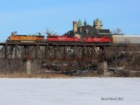 Bill Miller has a theory. When something odd comes along, take the shot in a location that gives context to how rare it is. Thanks to many heads-ups, I caught CP 141 with BNSF 4418, 6255, and 3053 cross the Grand River in Cambridge, Ontario. US leaders going west doesn't happen often in Ontario. 