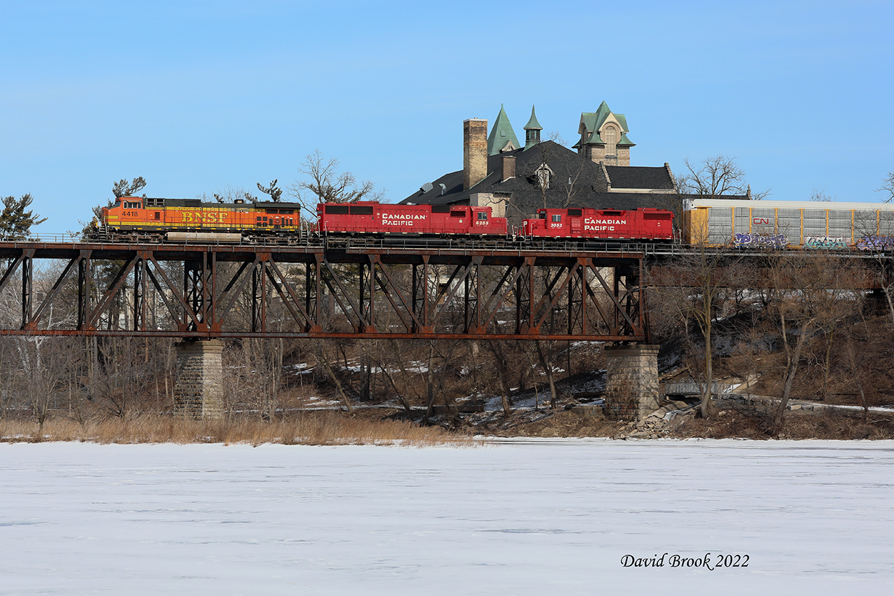 Bill Miller has a theory. When something odd comes along, take the shot in a location that gives context to how rare it is. Thanks to many heads-ups, I caught CP 141 with BNSF 4418, 6255, and 3053 cross the Grand River in Cambridge, Ontario. US leaders going west doesn't happen often in Ontario.