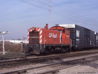  CP 6708 (SW8) switches out some hi-cubes for Ford Motor Co at the West end of Oakville Yard. At this date the CN and CP both had yard jobs switching Ford's Oakville assembly plant. However, a CP engine did not mean it was a CP crew. Crews were just assigned whatever power was available first. CP crews did prefer using the CN power as the cabs were much nicer.  