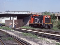 Caption this!  Apparently, over height cars do not fit under the bridge on this track.  SOU 43416 lies on its side after having lost its battle with the infamous Peabody Bridge which carried Riverside Drive above the CN tracks.  