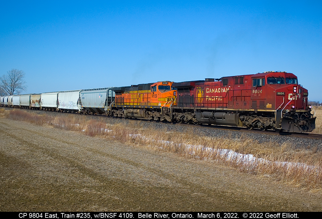 CP 9804 and BNSF 4109 lead a Sunday morning 234 out of Belle River, Ontario.  The train had been hit by the Hot Box detector in Puce resulting in a long stop at Belle River while the Conductor found several applied handbrakes in the train. After releasing about 4 handbrakes the train was underway again, although local traffic was not happy as both crossings in town had been blocked for about 45 minutes.