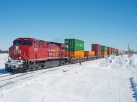 On a clear, -30 degree March day, a clean CP 8000 leads 113 past SNS Foot on the west side of Regina.  