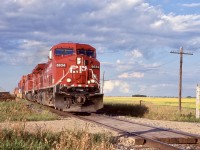 While the sight of three relatively clean AC4400’s  certainly were not worth writing home for. The overall scene is what made the photo for me, with a canola field in the background and thunderheads rapidly forming in the distance. Ashbury was once the location of a siding for CP, but it was removed. The clouds would only increase in size as we headed for Winnipeg this day, completely soaking us as we raced into the hotel.
