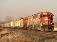 Late afternoon light shines on a westbound CP freight as it storms out of Hornby dip, with a good cut of grain cars on the head end. This days power is a pair of SOO SD60’s and a CP SD40. 