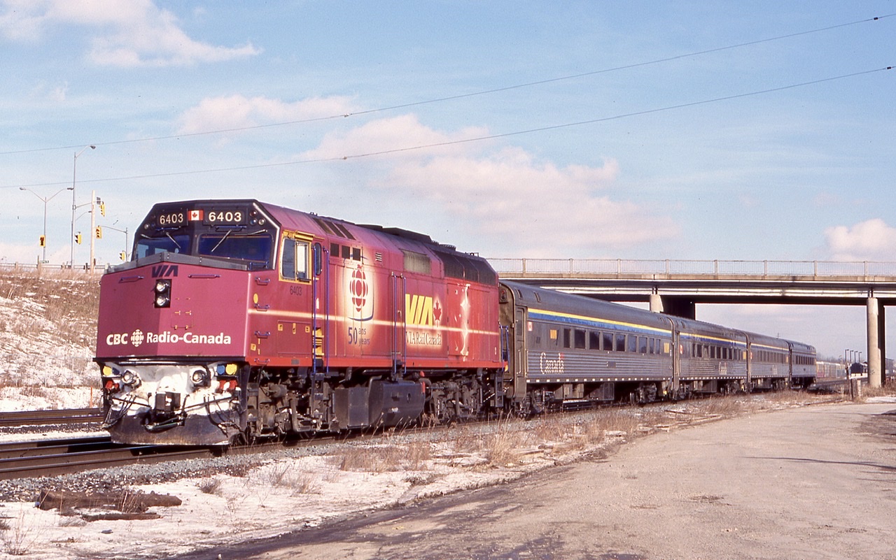 One of my favourite VIA wraps was the CBC 50 years F40. I was lucky enough to go to London with a railfan friend years ago to visit the special CBC train that travelled across Canada powered by this F40. Here it is seen powering train 73 as it rolls through Aldershot.