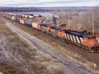 Railink was still pretty new by this date and CN still had a line local assigned to Hamilton in the form of 555. Just out of view to the left is the engine house. Railink power around this time was mainly old GP9’s and former CN M420’s. RLK 4205 can be seen in the distance in the yard while CN 555 has just entered the main in the background with a pair of GP9RM’s. CN 449 later replaced by 339 has a nice set of “stripes” in the form of a SD50 and 2 SD40’s as the stop long enough to work the yard before heading to the Niagara region.