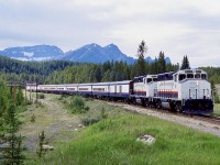 A pair of former CN GP40-2W’s in handsome Rocky mountaineer paint pull into Lake Louise with the Rocky Mountains making a beautiful backdrop. 