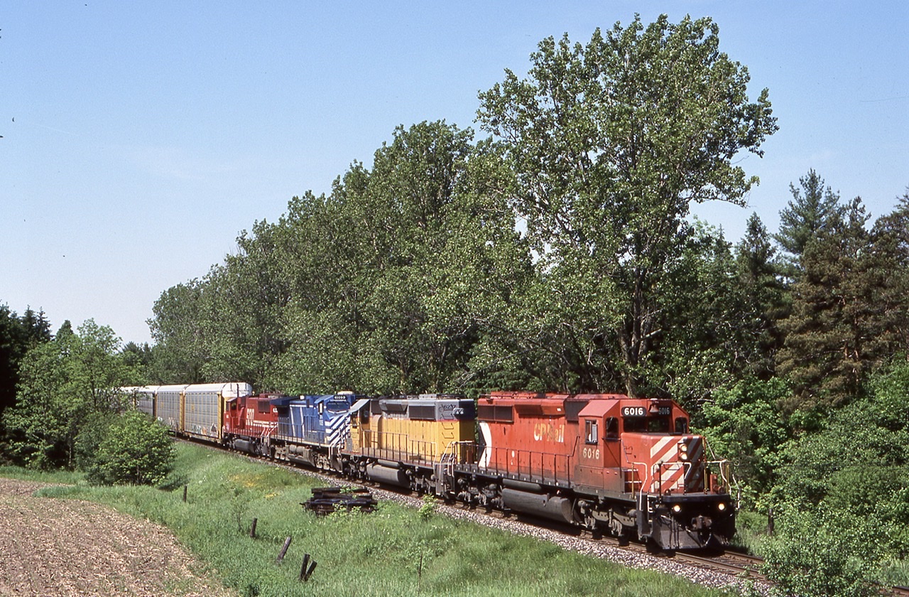 Just by fluke I passed by Finnigan, an old name used by CN behind Babcock and Wilcox in Cambridge. The area has since been completely rebuilt with grade separation. Years ago CP would often have mainline trains head to this location to grab any traffic needed out of Toyota. I believe this is all done now at Wolverton. Thus day there was a nice mix on 234 including two leased units. While I got a few shots of them in town this was my FA just east if Killean. A short hike into the farmers field and a bit of a wait was worth it as the train rolled eastward for Toronto.