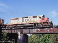 A set of SOO power leads what is likely a rock train headed for Aberdeen Yard southbound on the Hamilton sub crossing over Bronte Creek/Progreston Pond.